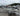 White Smoker Craft fishing boat with Yamaha 20HP outboard, on EZ Loader trailer, parked on wet pavement at Y Marina lot