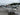 White Smoker Craft fishing boat with Yamaha 20HP outboard, on EZ Loader trailer, parked on wet pavement at Y Marina lot