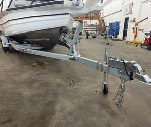 EZ Loader galvanized boat trailer with winch and heavy-duty frame available at Y Marina
