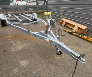 Galvanized Smoker boat trailer with winch and rollers for easy loading at Y Marina