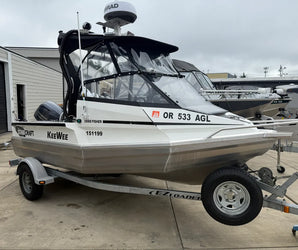 White Stabicraft 1550 Fisher boat named “KeeWee” on an EZ Loader trailer, featuring a Yamaha motor and enclosed cabin