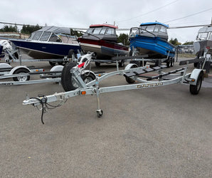 Calkins galvanized boat trailer with spare tire and roller system available at Y Marina